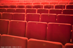 Rows of red cinema seats